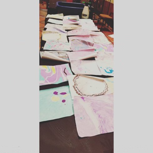 Table full of suminagashi at the Santa Fe Japan Festival